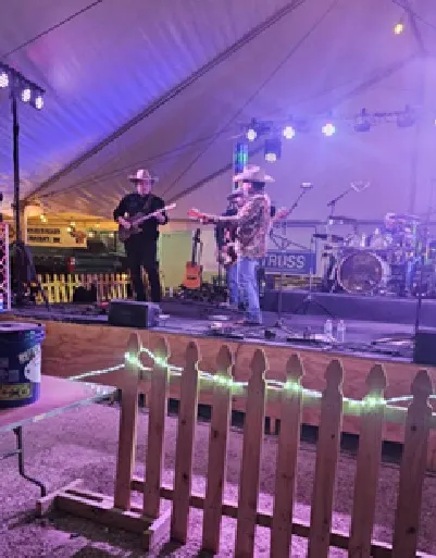 Stage lights over the band during the evening concert.